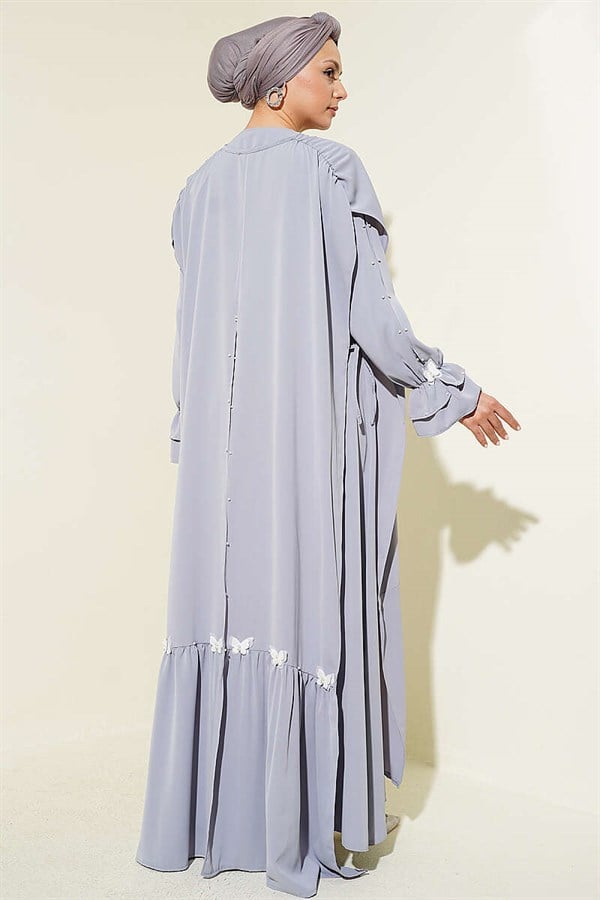 Gray Dress with Pearl Embellishments and Butterfly Cape