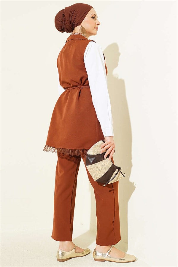 2 Piece Set in tan: vest with ruffled lace detail and drawstring detail.