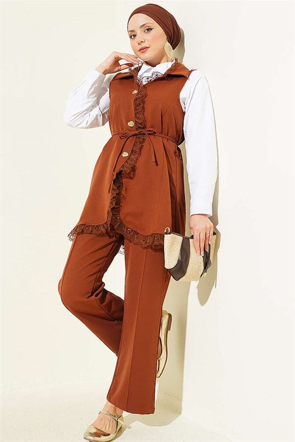 2 Piece Set in tan: vest with ruffled lace detail and drawstring detail.