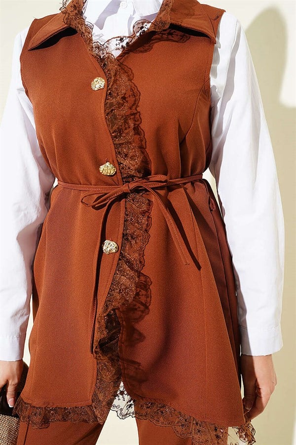 2 Piece Set in tan: vest with ruffled lace detail and drawstring detail.