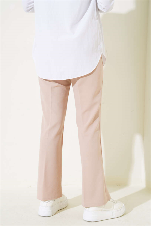 Spanish-style flared double-waisted trousers in beige with elastic waistband.