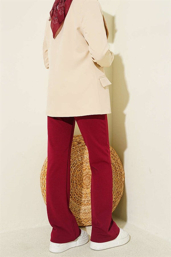 Spanish-style flared trousers with elasticated waistband, burgundy.