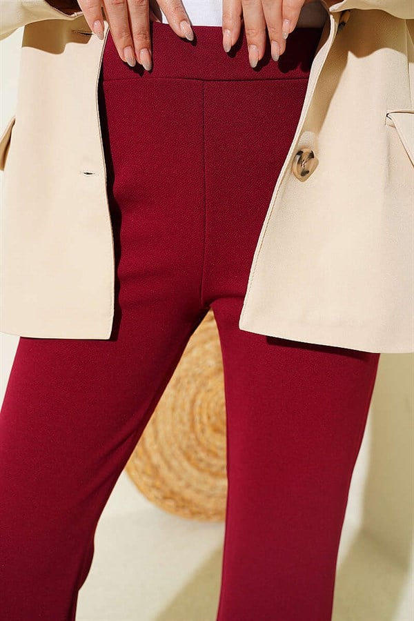 Spanish-style flared trousers with elasticated waistband, burgundy.