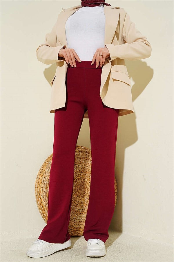 Spanish-style flared trousers with elasticated waistband, burgundy.