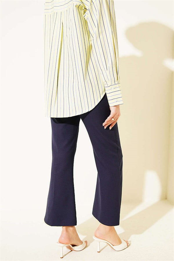 Spanish-style flared double-leg trousers, navy blue.