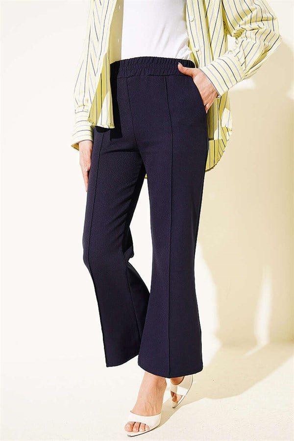 Spanish-style flared double-leg trousers, navy blue.
