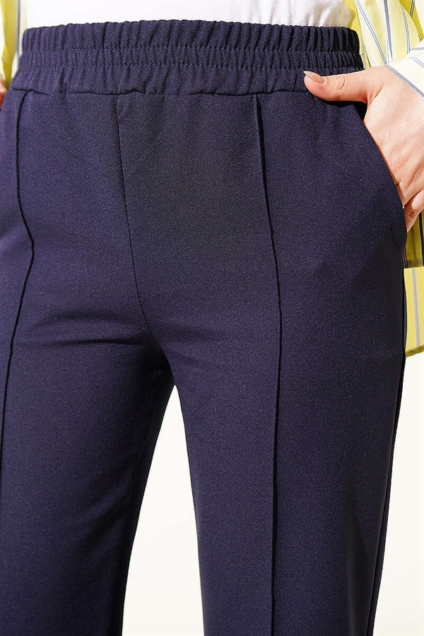Spanish-style flared double-leg trousers, navy blue.