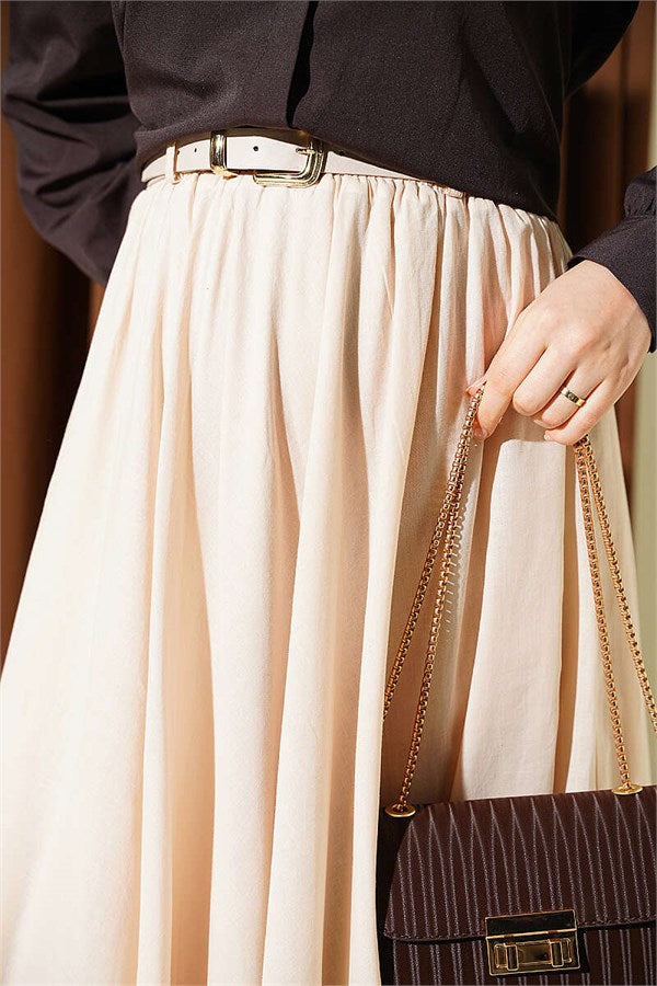 Cream-colored voile skirt with elastic waistband.