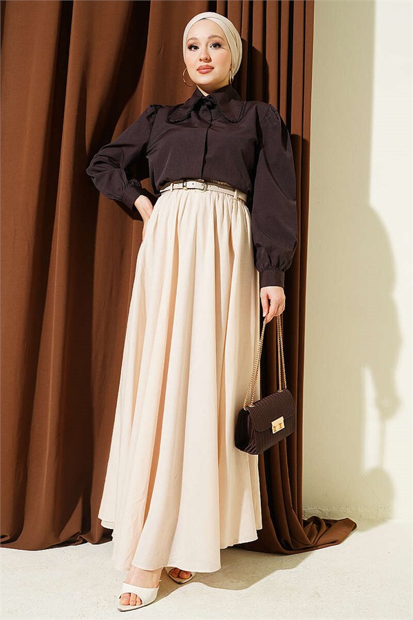 Cream-colored voile skirt with elastic waistband.