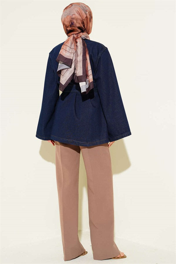 Loose-fitting denim blue jacket with belt.