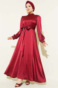 Self-belted satin evening dress in burgundy.
