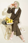 Double-breasted suit with gold buttons, khaki.