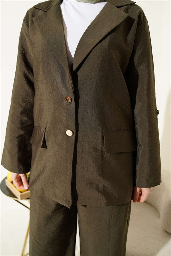 Double-breasted suit with gold buttons, khaki.