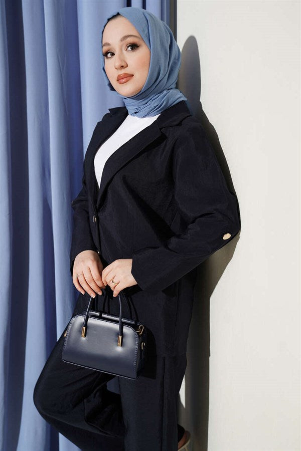 Double-breasted suit with gold buttons, navy blue.