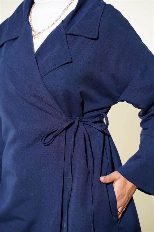 Double-breasted trench coat with drawstring closure, navy blue.