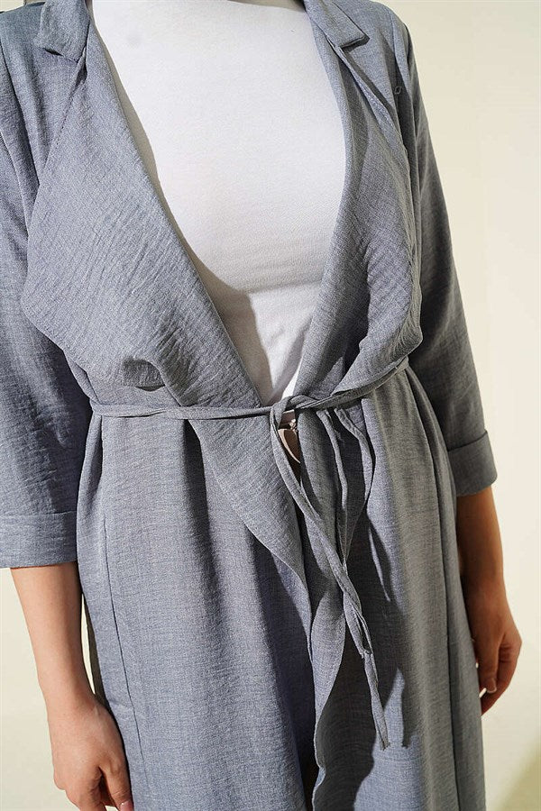 Double-breasted coat with drawstring detail in grey.