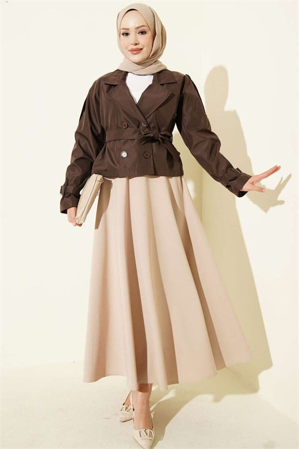 Double-breasted belted short trench coat in brown.
