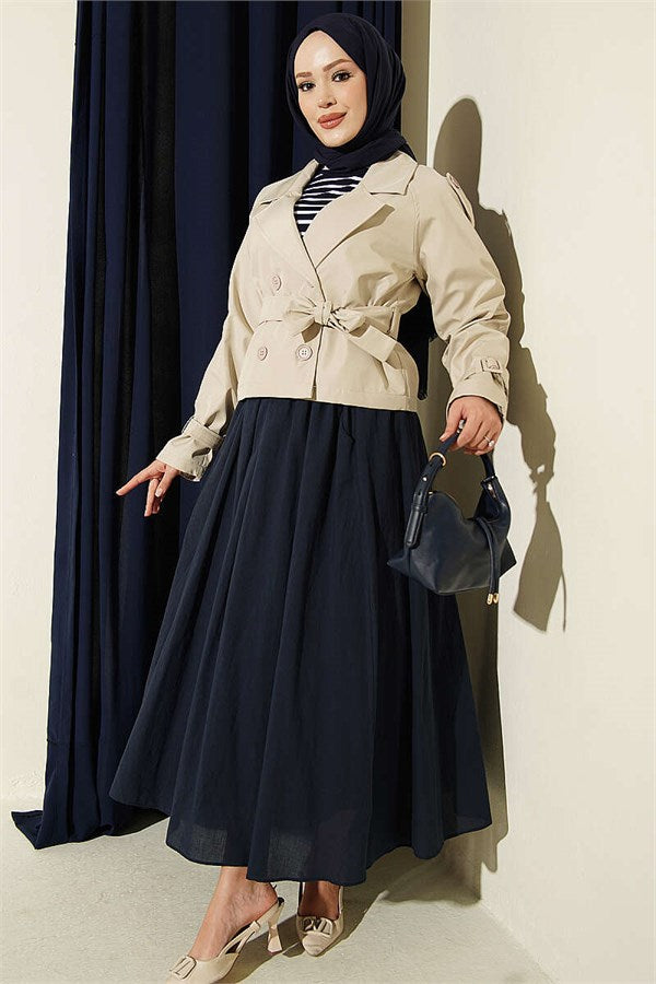 Double-breasted belted short trench coat in stone.