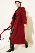 Double-breasted, belted, long cashmere coat in burgundy.