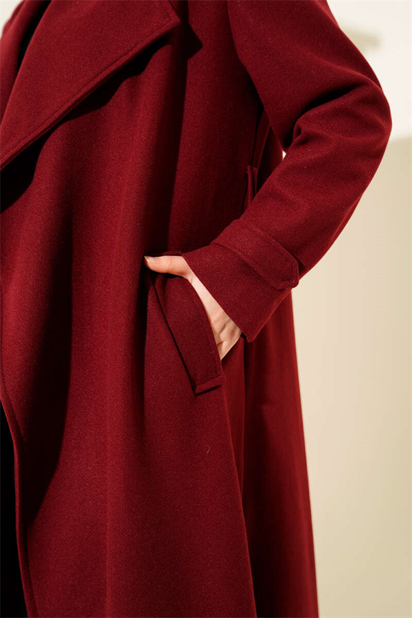 Double-breasted, belted, long cashmere coat in burgundy.