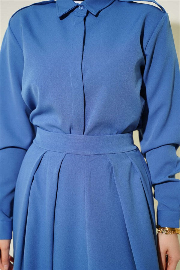 2 Piece Set with pleated skirt and shoulder epaulets, blue.