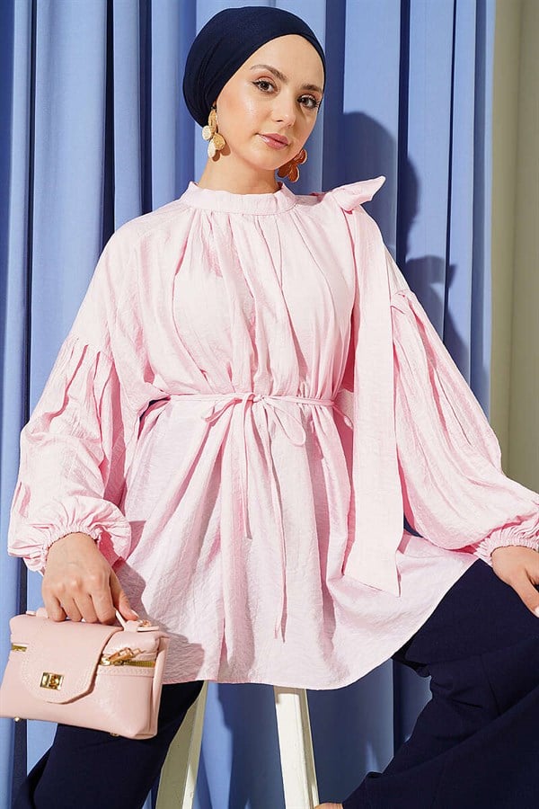 Loose-fitting tunic with shoulder bow, pink.