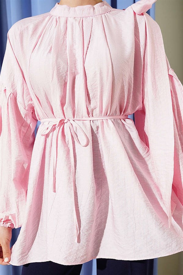 Loose-fitting tunic with shoulder bow, pink.