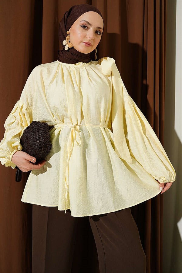 Loose-fitting tunic with shoulder bow, yellow.