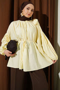 Loose-fitting tunic with shoulder bow, yellow.