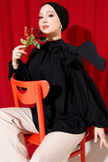 Loose-fitting tunic with shoulder bow, black.