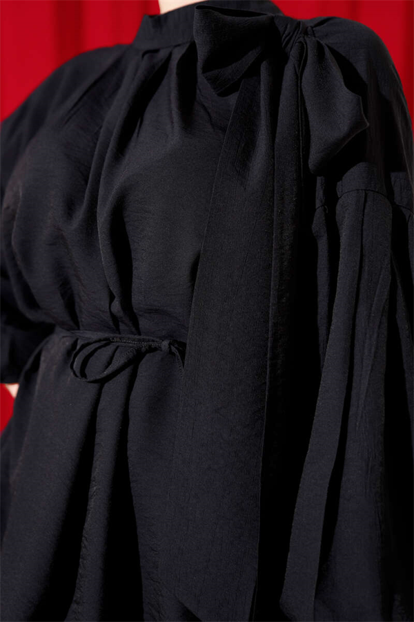 Loose-fitting tunic with shoulder bow, black.
