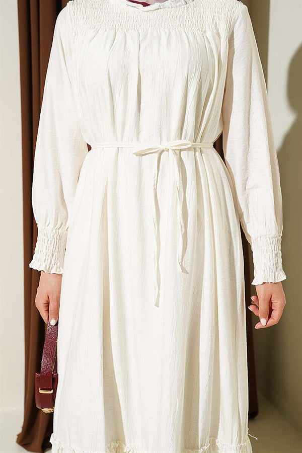 Ecru Ruffled Dress with G-Length and Embellishments at the Front and Ankles