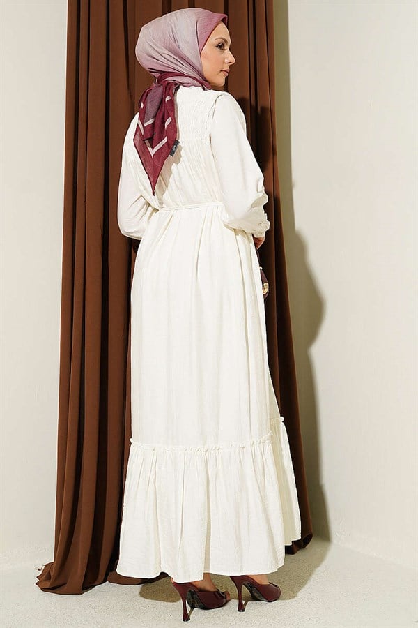 Ecru Ruffled Dress with G-Length and Embellishments at the Front and Ankles