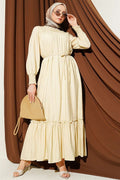 Sand Beige Ruffled Dress with G-Length and Embellishments at the Front and Ankles
