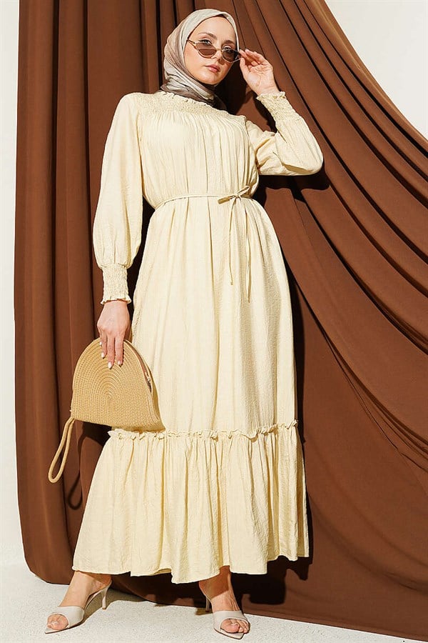 Sand Beige Ruffled Dress with G-Length and Embellishments at the Front and Ankles
