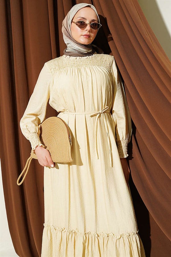 Sand Beige Ruffled Dress with G-Length and Embellishments at the Front and Ankles