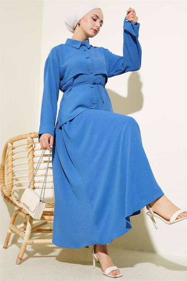 Aerobin Suit with Piece Detail and Belted Skirt in Indigo