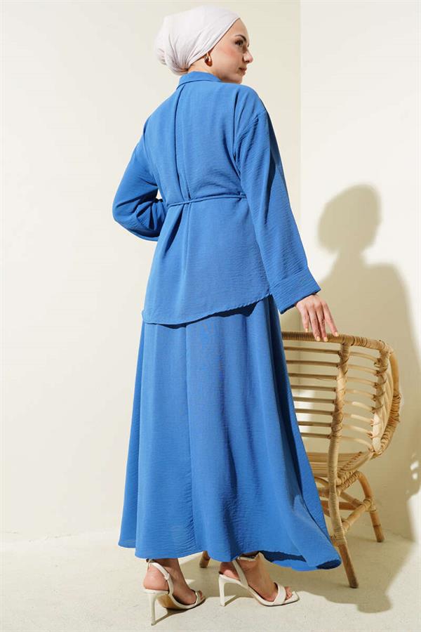Aerobin Suit with Piece Detail and Belted Skirt in Indigo