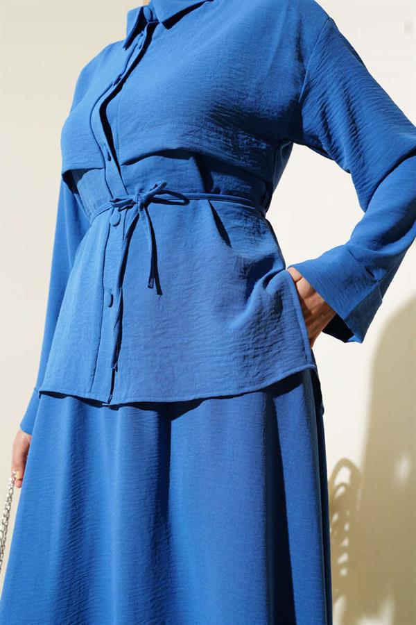 Aerobin Suit with Piece Detail and Belted Skirt in Indigo