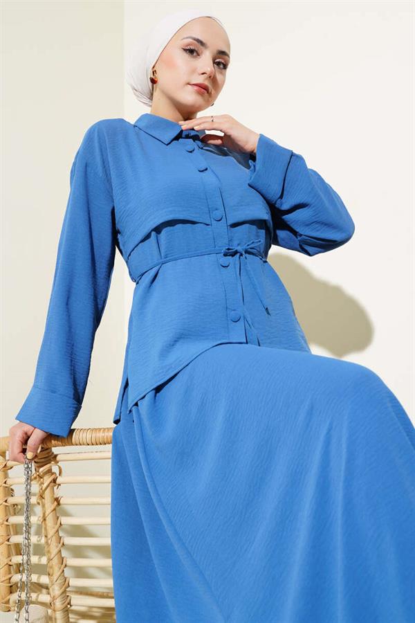 Aerobin Suit with Piece Detail and Belted Skirt in Indigo