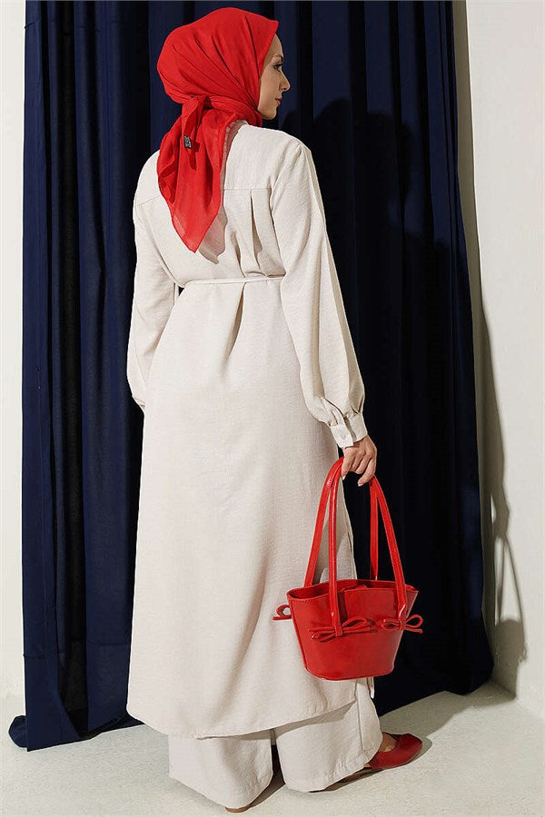 Two-piece set with gold accessories and symbol, beige.