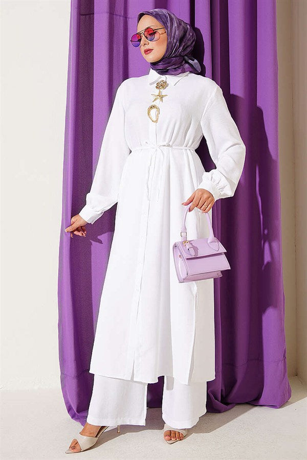 2 Piece Set in white with gold accessories and symbolic design.