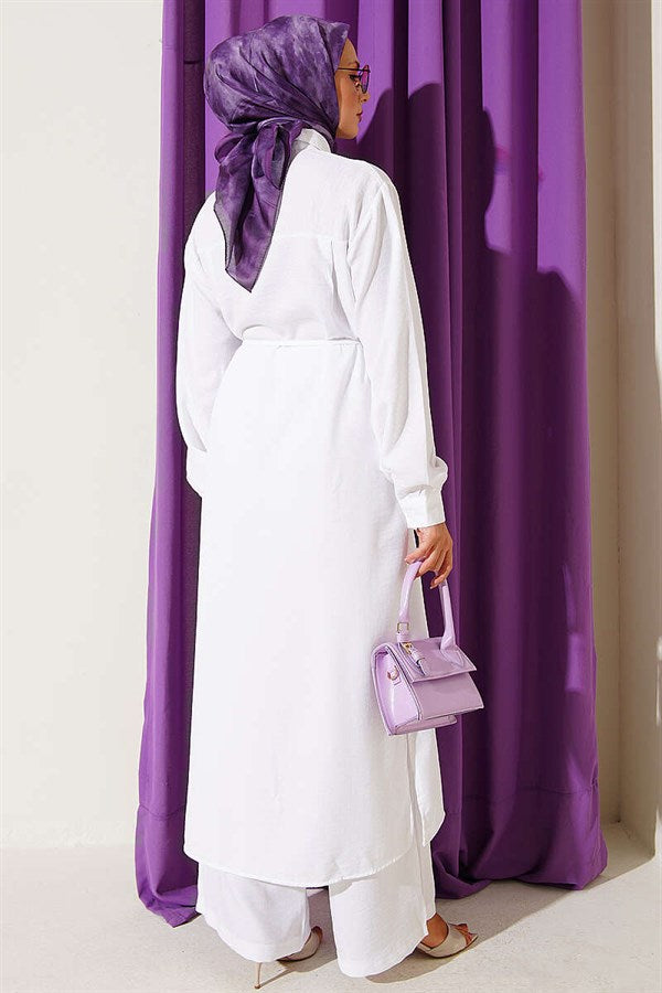 2 Piece Set in white with gold accessories and symbolic design.