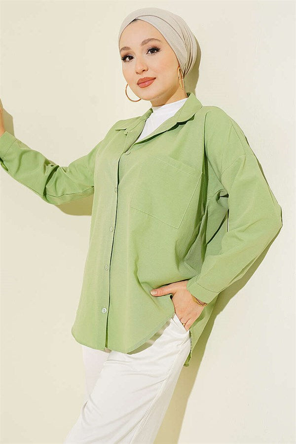 Loose-fitting shirt with one breast pocket, light green.