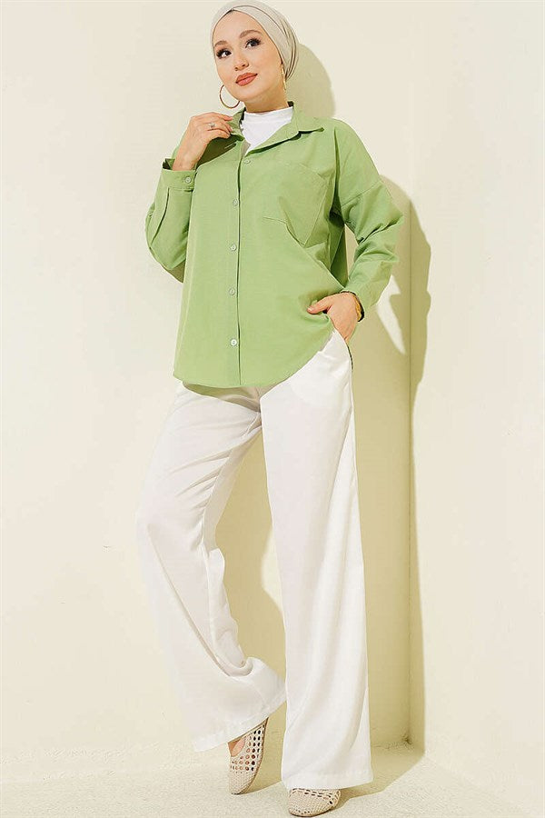 Loose-fitting shirt with one breast pocket, light green.