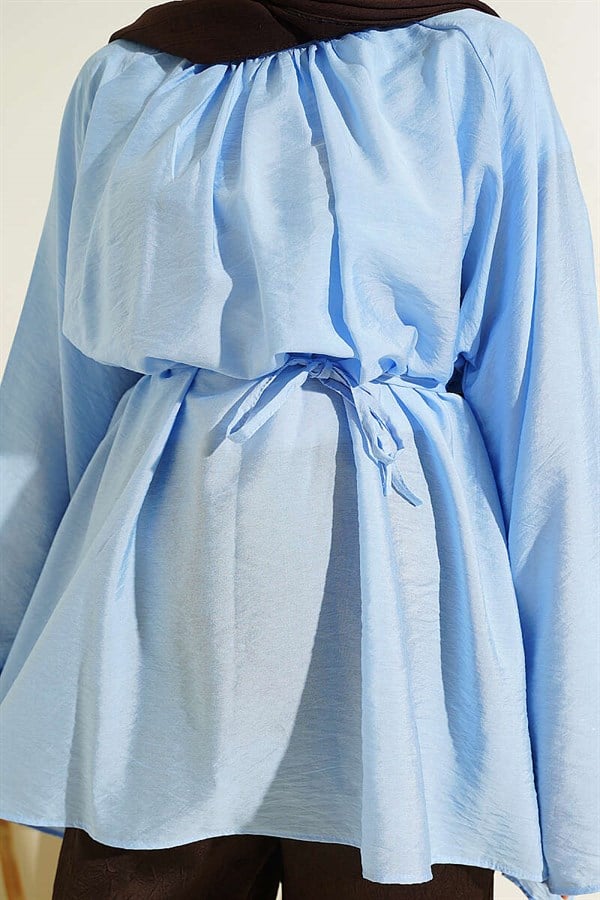Loose-fitting tunic with pleated collar and drawstring belt, blue.