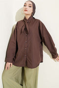 Loose-fitting shirt with drawstring collar, brown.
