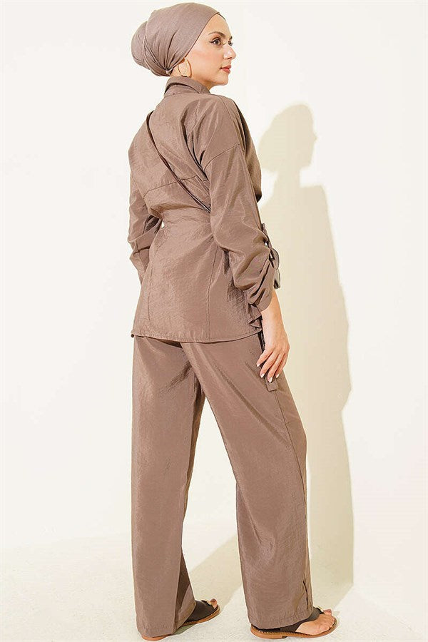 2 Piece Set in mink color with hidden button closure and buckle detail on the sides.